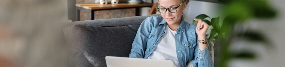 Woman looking at laptop