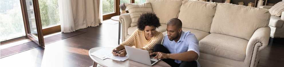 Couple looking at laptop