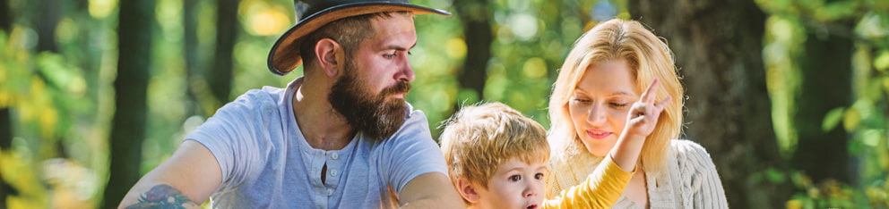 Family sitting in the woods