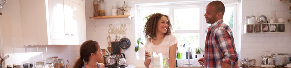 Family talking in kitchen